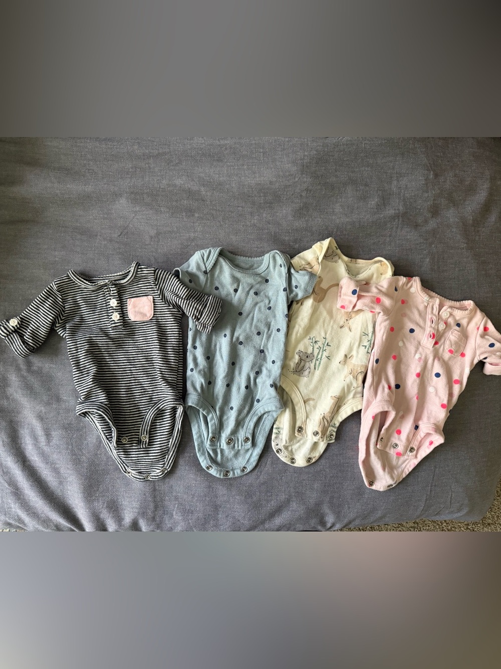 Bundle of Four Newborn Onesies